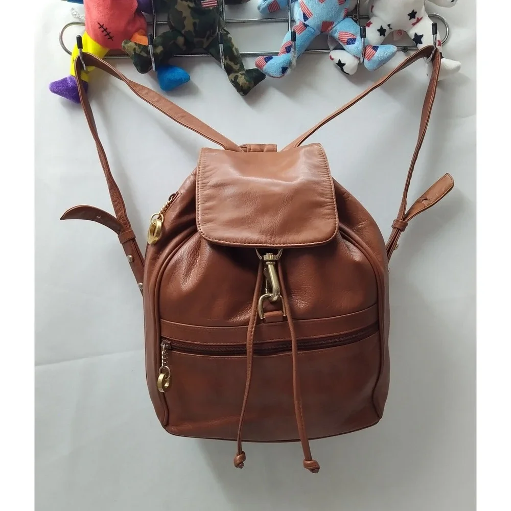 Perlina Brown Leather Zipper Pockets Flap Top Handle Drawstring Backpack